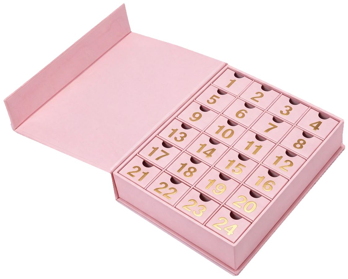 Calendrier de l’Avent 24 cases, boîte rose ouverte, tiroirs numérotés en doré