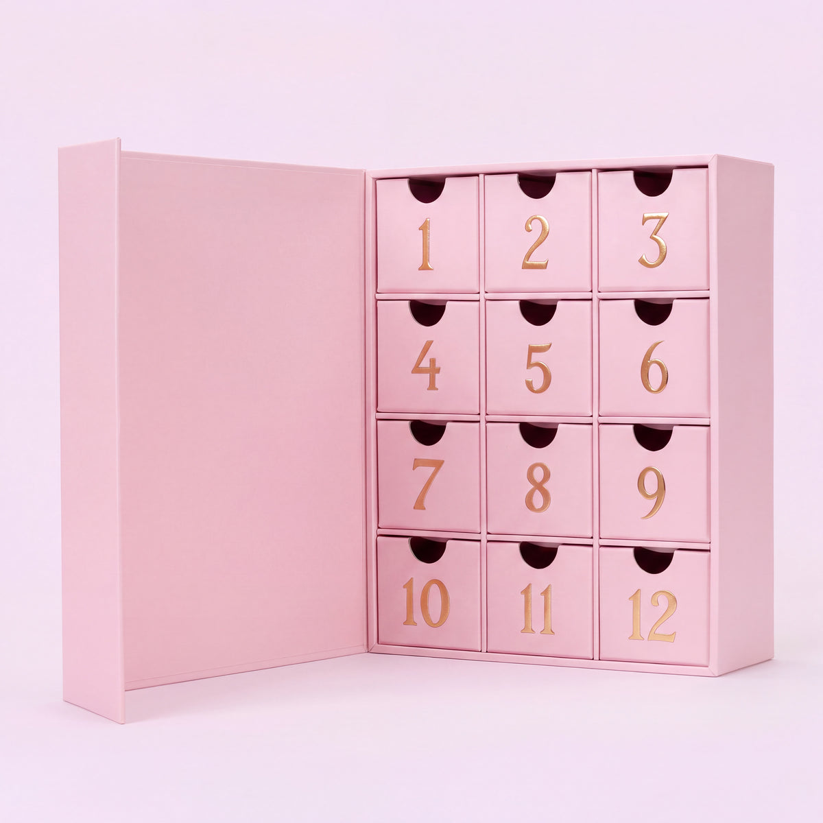 12 cases — Calendrier de l'Avent bijoux 12 cases ouvert vu de face, tiroirs numérotés dorés.