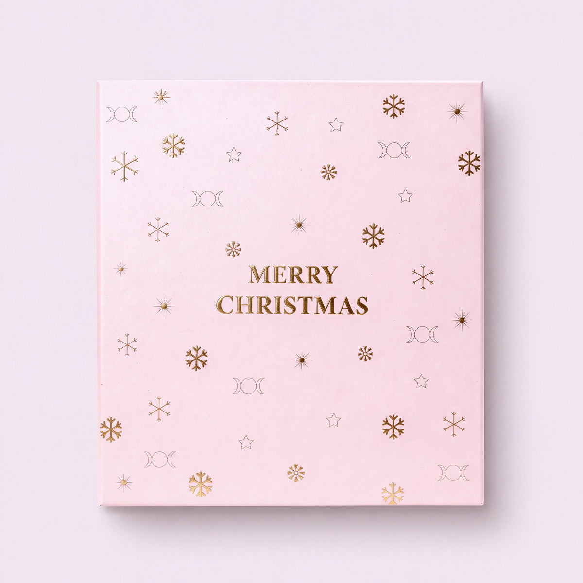 12 cases — Calendrier de l'Avent 12 cases fermé vu de dessus, couvercle rose pâle avec dorure Merry Christmas.
