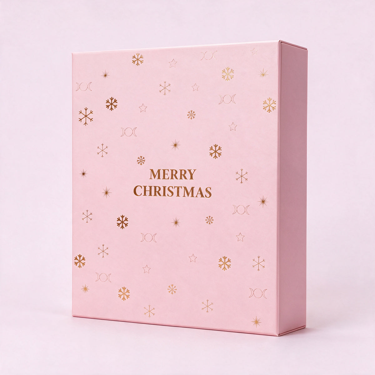 24 cases — Calendrier de l'Avent bijoux, boîte rose pâle fermée, debout, vue de trois quarts, dorure Merry Christmas.
