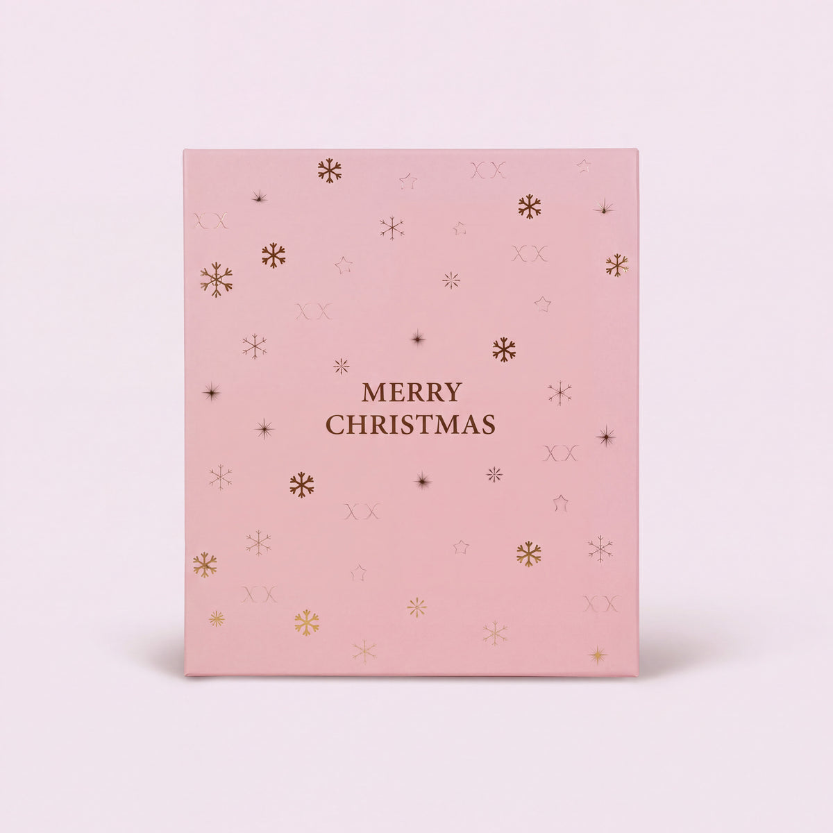 24 cases — Calendrier de l'Avent bijoux fermé vu de face, boîte rose pâle avec flocons et étoiles dorés.